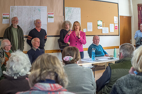 Helen addresses her public meeting