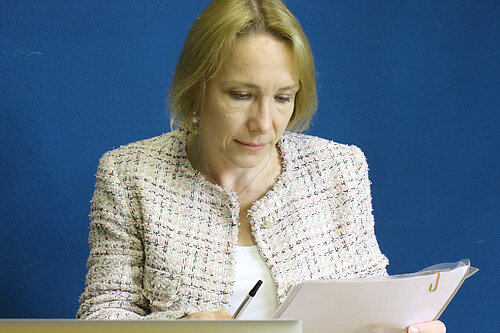 Helen Morgan going through her paperwork