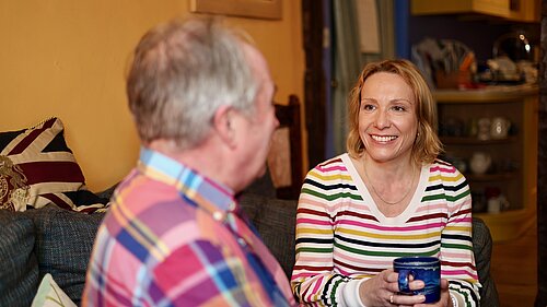 Helen smiling with local resident