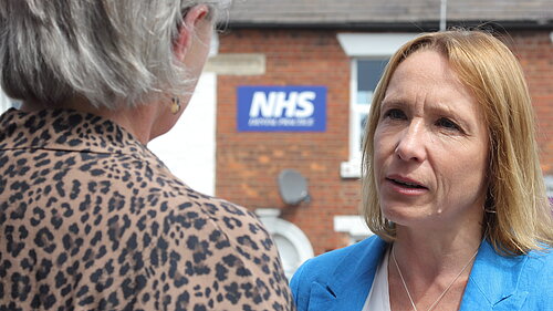 Photo of Helen Morgan outside an NHS building