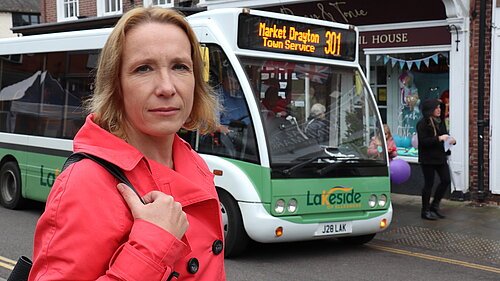 Helen Morgan with a local bus