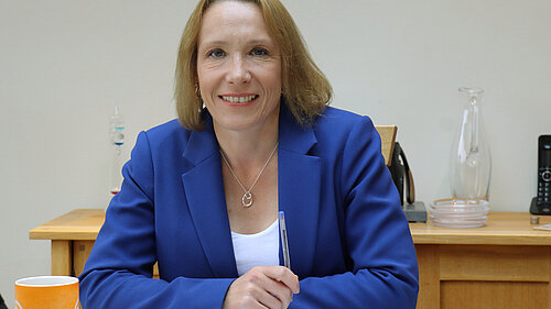 Helen at her desk