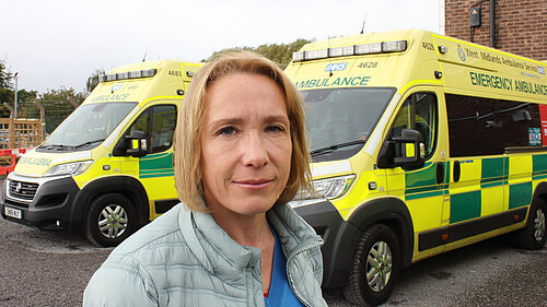 Helen Morgan with a local ambulance