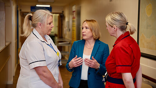 Helen talking to nurses at a local hospital