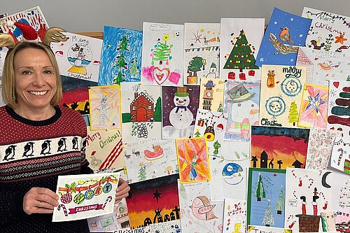Helen Morgan MP with entries to her Christmas card competition 