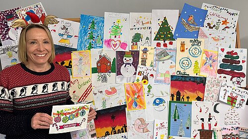 Helen Morgan MP with entries to her Christmas card competition 