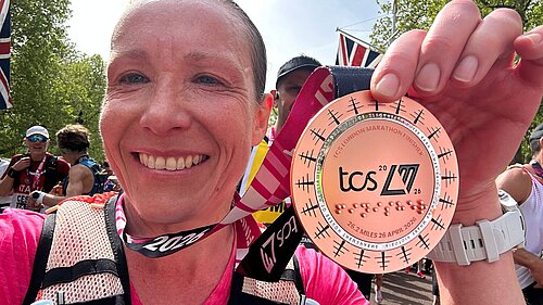 Helen Morgan MP with London Marathon medal